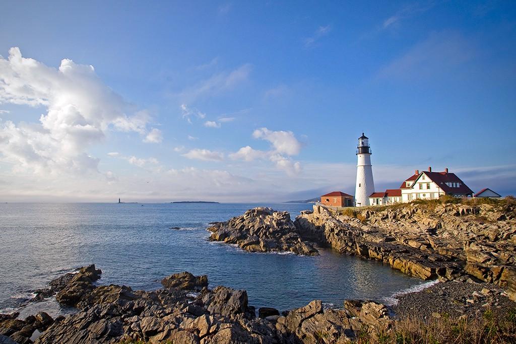 The Portland Head Light on the rocky coast of Maine overlooking the ocean